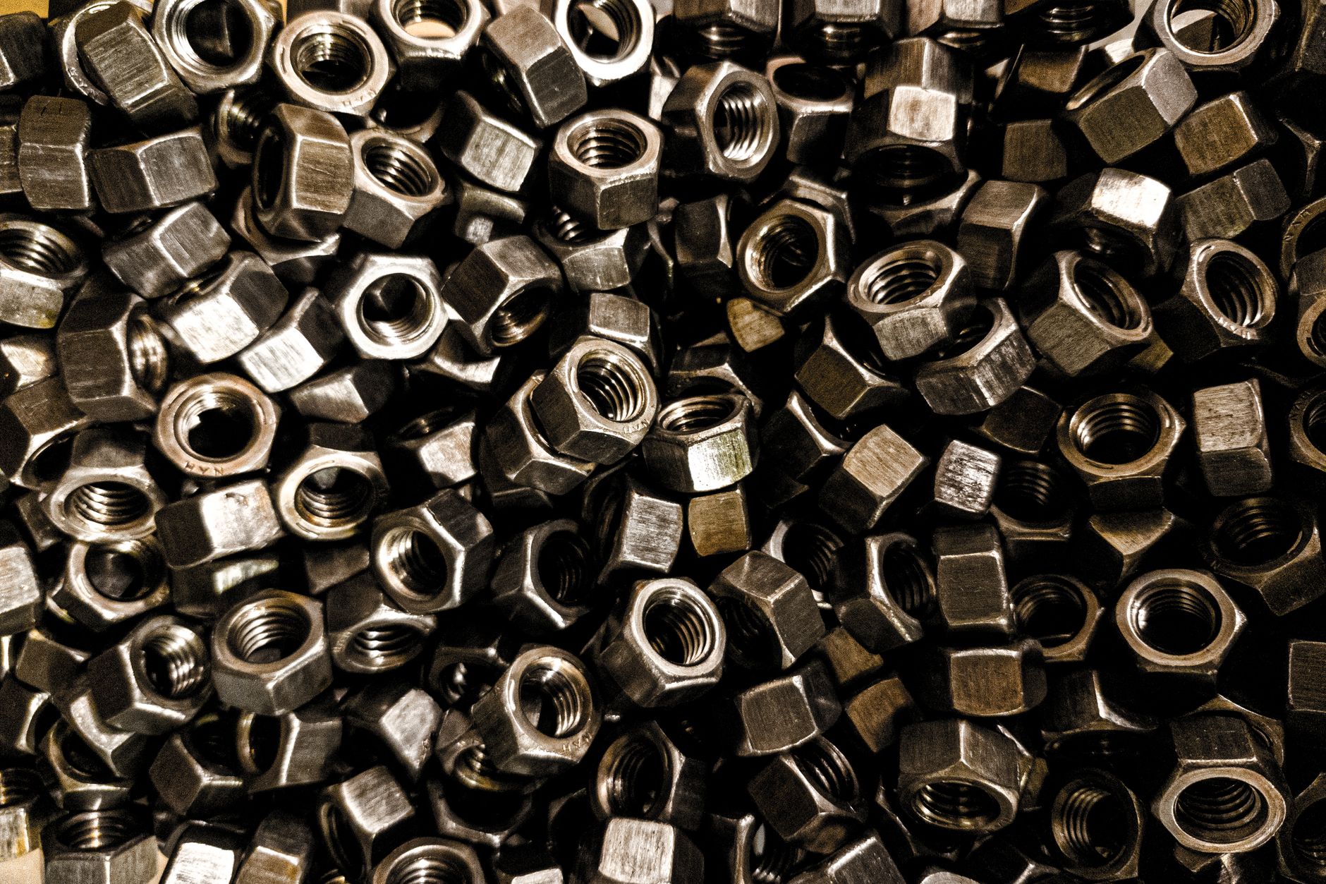 A collection of metal nuts and fasteners